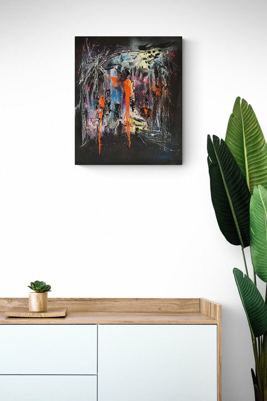 Black and orange abstract painting in interior