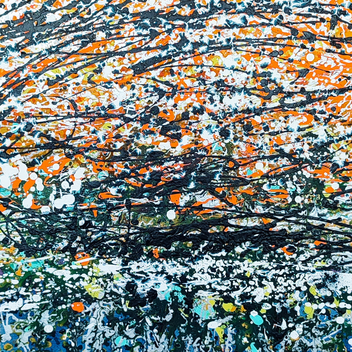Close-up of the colourful dripping paintwork in this abstract artwork