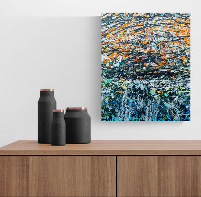 Colourful abstract wall art displayed above a sofa in a contemporary interior