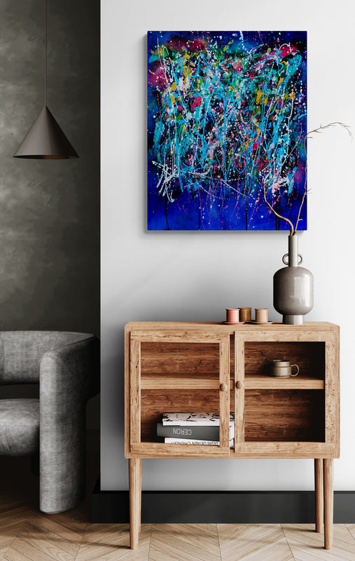 L’éclate totale blue abstract painting displayed in a contemporary interior